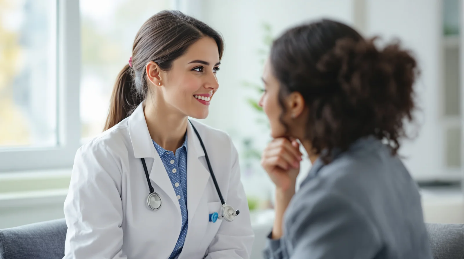 OB/GYN reviewing a patient's menstrual history during a consultation at Legacy OB/GYN in Frisco, TX